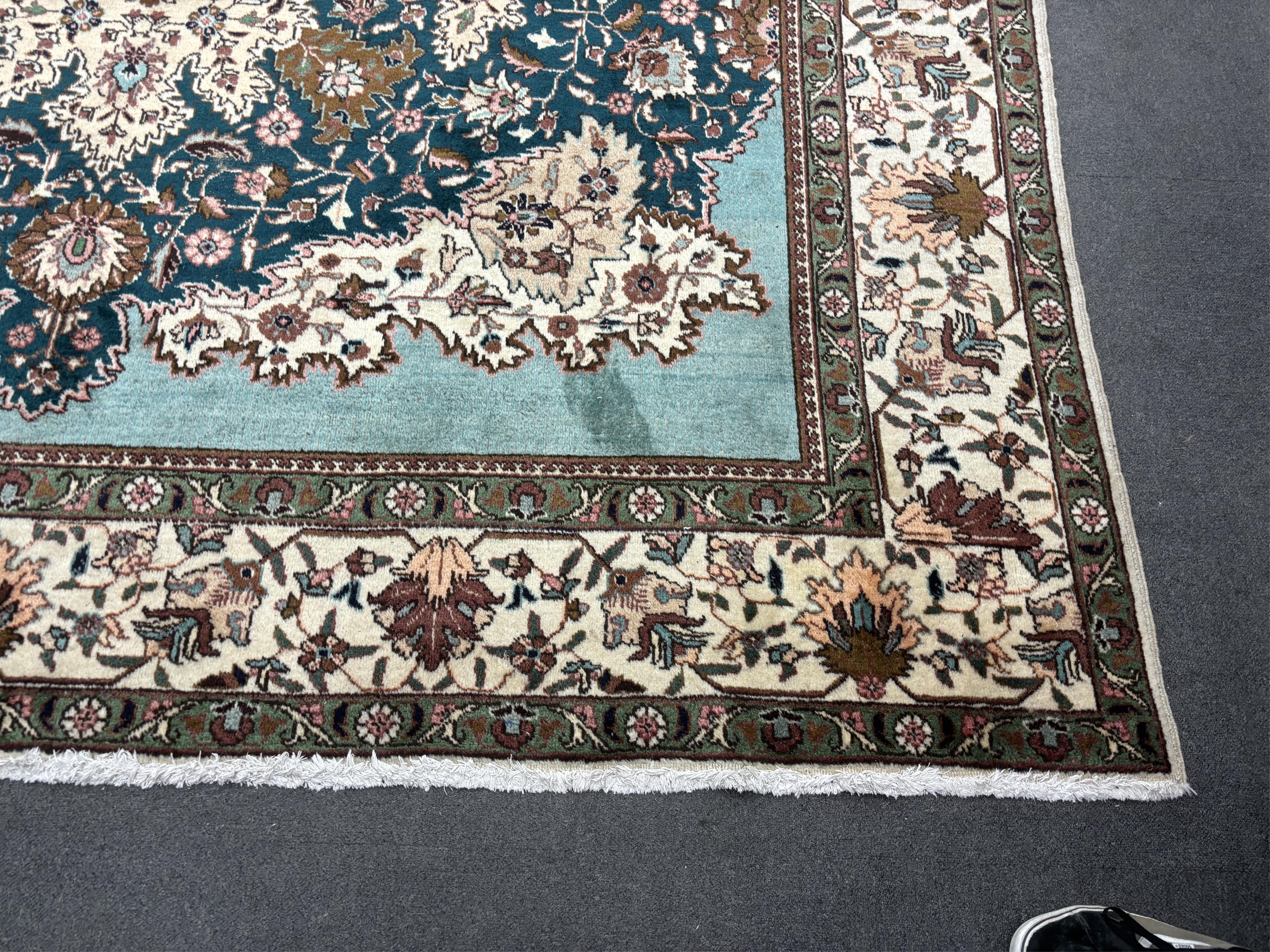 A Tabriz carpet, 400 x 310cm